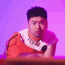 a man wearing a white shirt that says nor ny on it