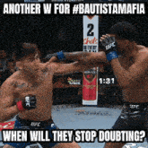 two men are fighting in a cage with the caption another w for #bautistamafia