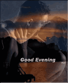 a picture of a man and woman kissing with the words good evening above them