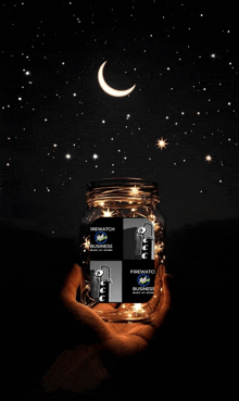 a person holding a jar that says firewatch brewing business