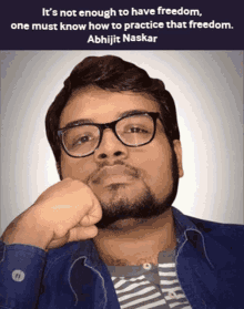 a man with glasses and a beard has a quote from abhijit naskar