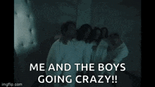 a group of people are sitting next to each other in a room and they are all going crazy .