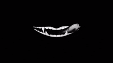a black and white image of a mouth with teeth and the words but i suppose it will slake the hunger for a little