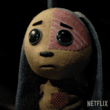 a stuffed animal with a netflix logo in the corner