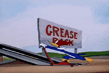 woody woodpecker is riding a skateboard down a ramp in front of a grease pack sign .