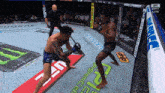 two men are fighting in a boxing ring with ufc written on the side