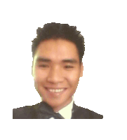 a man in a tuxedo and bow tie is smiling for the camera
