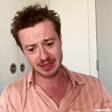a close up of a man 's face with joequinngifs written on the bottom right