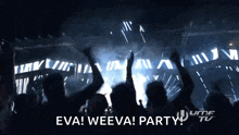 a crowd of people at a concert with the words eva weeva party in the corner