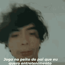 a close up of a person 's face with the words `` joga no peito do pai que eu quero entretenimento '' written on it