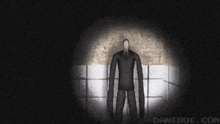 a man with very long arms is standing in a dark room with a light shining on him .