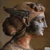 a statue of a woman with wings on her head has pixiz written on the bottom