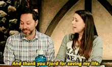 a man and a woman are sitting next to each other and the man is saying and thank you fjord for saving my life .