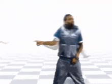 a man in a vest is dancing with his hand up