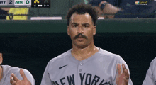 a man wearing a new york jersey is sweating