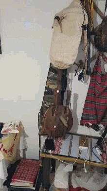 a bunch of objects on a table including a bag that says ' s & t ' on it