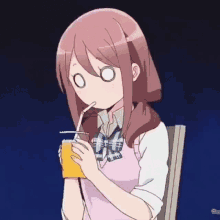a girl is drinking juice through a straw .