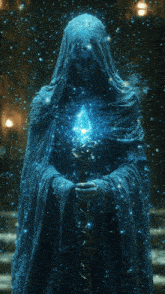 a statue of a man in a blue robe holding a staff