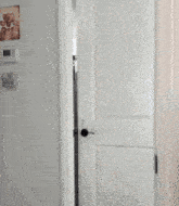 a person is standing in a bathroom doorway