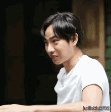 a man in a white shirt with judleklek702 on the bottom