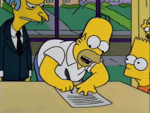 Homer Simpson signing a piece of paper