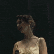 a woman wearing a white dress and a necklace
