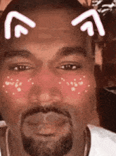 a close up of a man 's face with cat ears on it