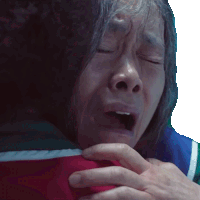 a close up of a person 's face with their eyes closed