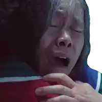 a close up of a person 's face with their eyes closed