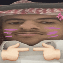 a close up of a man 's face with a pink bow on his head