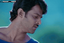 a close up of a man 's face with the words pranay_varma on the bottom right