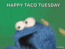cookie monster holding a taco with the words happy taco tuesday