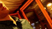 a blurry picture of a man looking up at something