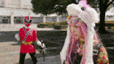 a girl with pink hair and a bunny hat is standing next to a red samurai