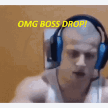 a man wearing headphones says " omg boss drop " in yellow letters