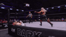 a woman is wrestling another woman in a ring that says aew dark