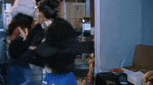 a blurry picture of a woman in a blue skirt