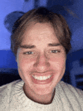 a close up of a young man 's face with the face app app visible