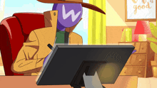a cartoon character with a w on his face is sitting in front of a computer screen