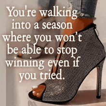 a woman wearing a pair of rhinestone high heels with a quote about winning