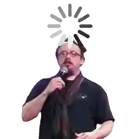 a man is holding a microphone with a loading screen behind him