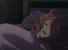 a girl with red hair is sleeping in a dark room