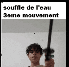 a man is holding a sword in front of a sign that says souffle de l ' eau 3eme mouvement