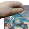 a close up of a person 's hand holding a piece of paper with a picture of a robot on it .