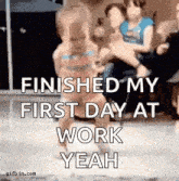 a man is holding a little girl in his arms and says `` finished my first day at work yeah ''