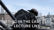 a fireman is sitting in the last steps of a lecture like stairs .