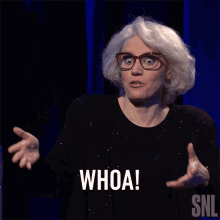 a woman with glasses says whoa in a snl advertisement