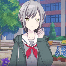 a girl with gray hair and green eyes is wearing a green jacket