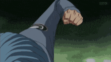 a person 's fist is visible in a pixelated image