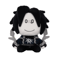 a black and white stuffed animal with a face that says ' o ' on it